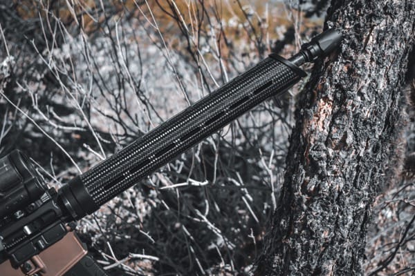 carbon fiber 15 inch ar15 handguard on assembled rifle in brush