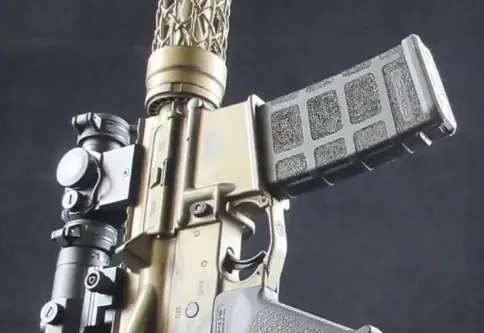 ar15 rifle with gold cerakote and carbon fiber handguard