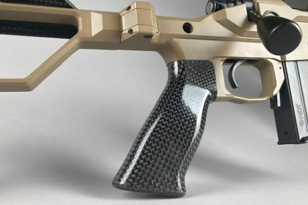 AR15 tan cerakoted rifle with carbon fiber pistol grip.